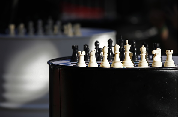 Business strategy competitive ideas concept, Chess game on chess board  behind business background. Business present financial and marketing  strategy analysis. Investment target in global economy . Business Images