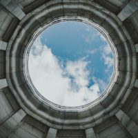 A round hole showing blue sky