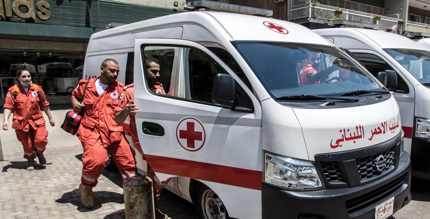 red cross bus and staff