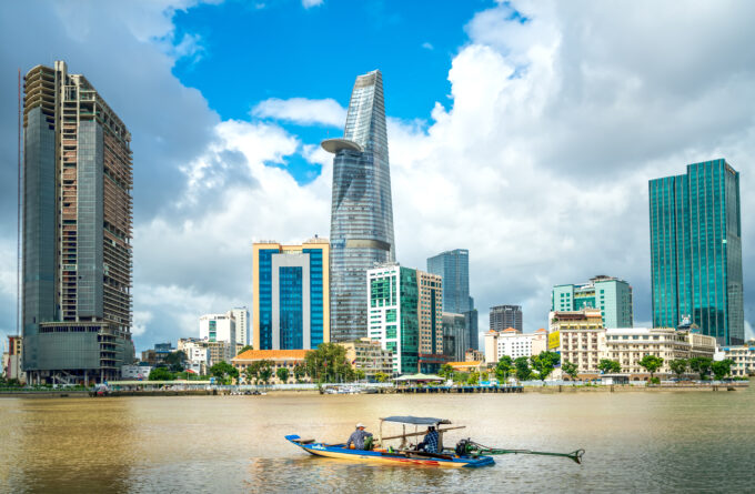 Skyscrapers along river with architecture office towers hotels center cultural and commercial development country most in Ho Chi Minh city Vietnam developped country