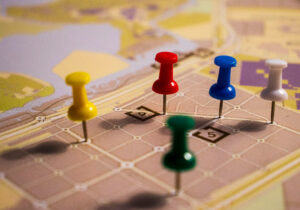 supply chain reorganization - pawns moving on a map