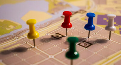 supply chain reorganization - pawns moving on a map