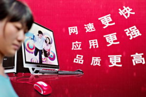 A woman walks past a chinese billboard advertising - IMD Business School - IMD Business School