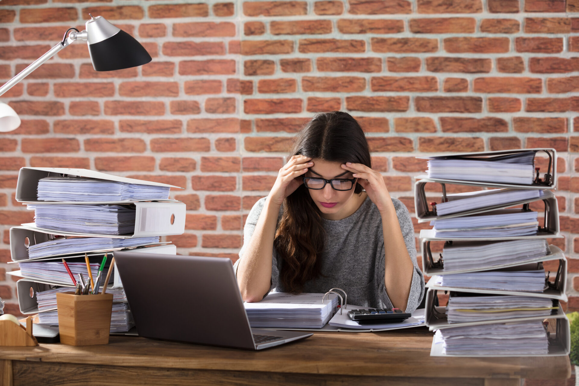Tired Businesswoman Surrounded by work