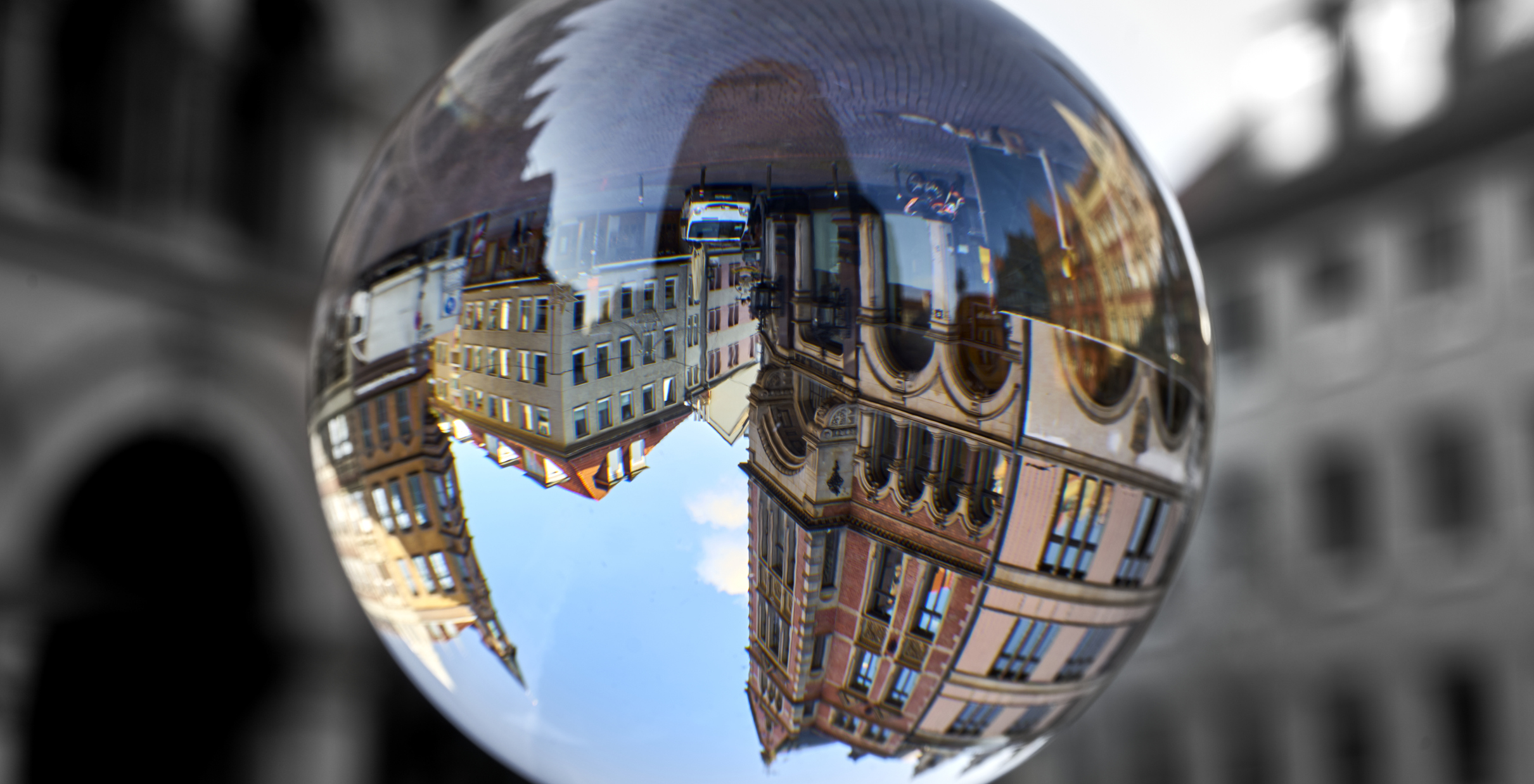 Town houses in the old town of Hanover Germany upside down through a glass ball
