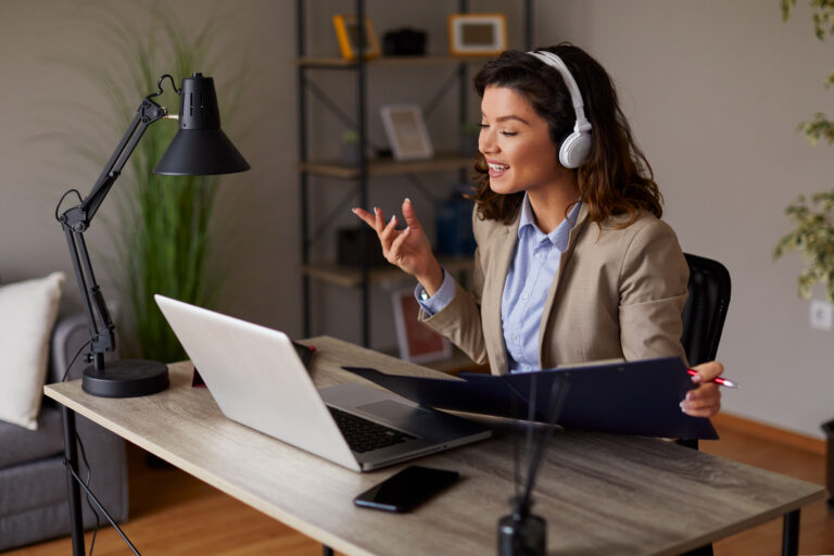Young woman has a business conference via laptop