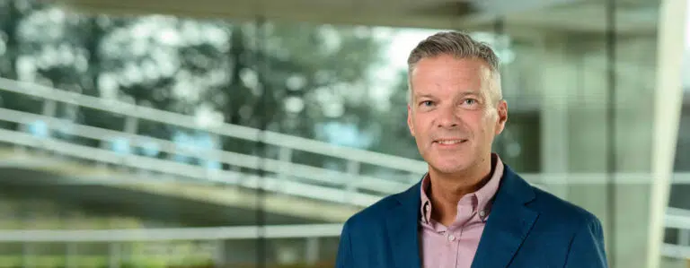 Portrait of Michael Wade an IMD Professor of Strategy and Digital, pictured in front of the IMD campus - IMD Business School