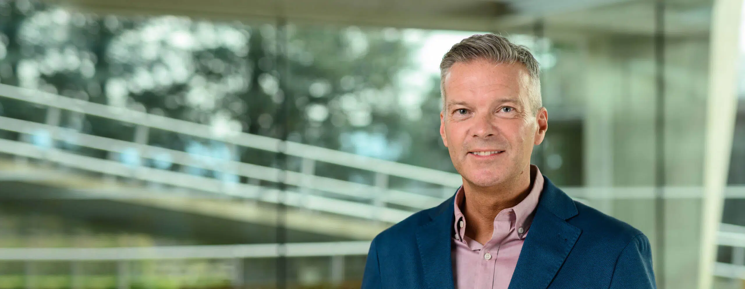 Portrait of Michael Wade an IMD Professor of Strategy and Digital, pictured in front of the IMD campus - IMD Business School
