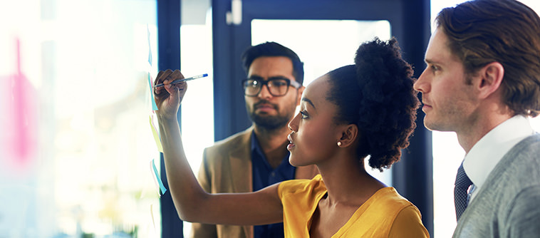 business woman taking notes - IMD Business School