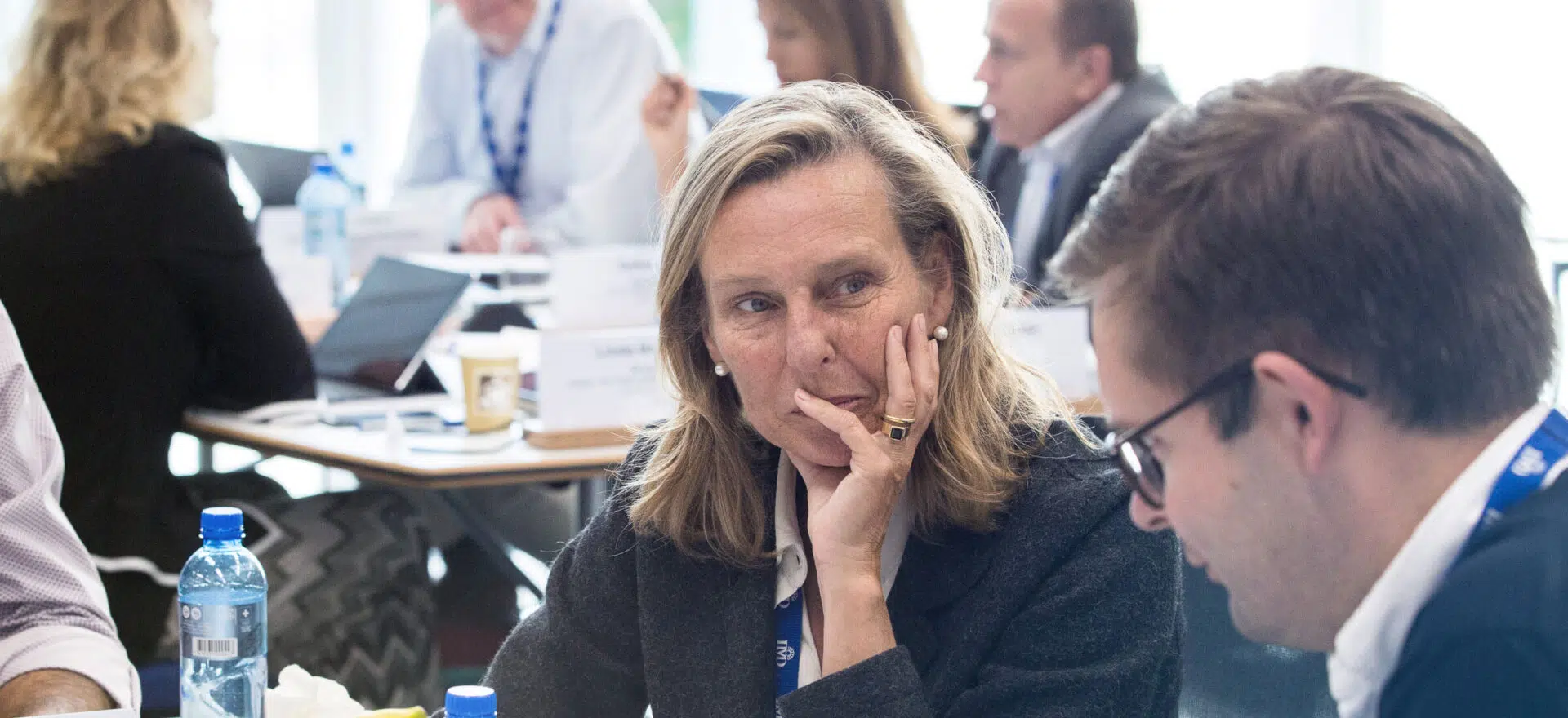 Board members in discussion during an IMD governance program - IMD Business School