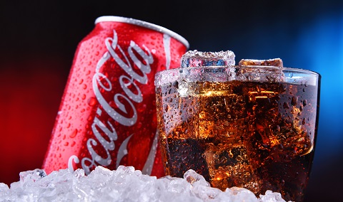 Can and glass of coca-cola with ice in the foreground - IMD Business School