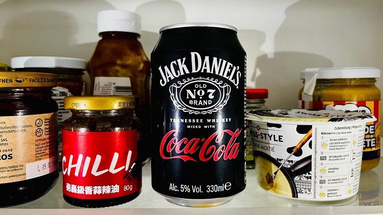 A can of Jack Daniels Coca-Cola in a fridge.