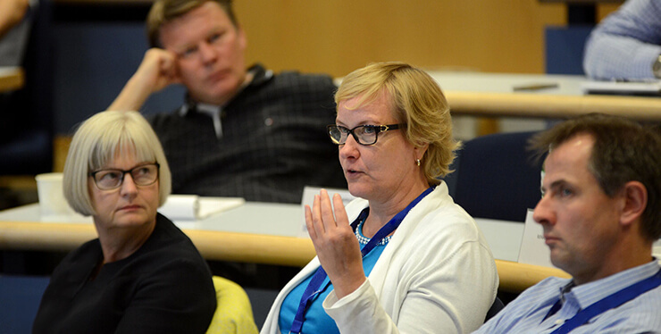 Woman board member in an auditorium at IMD business school