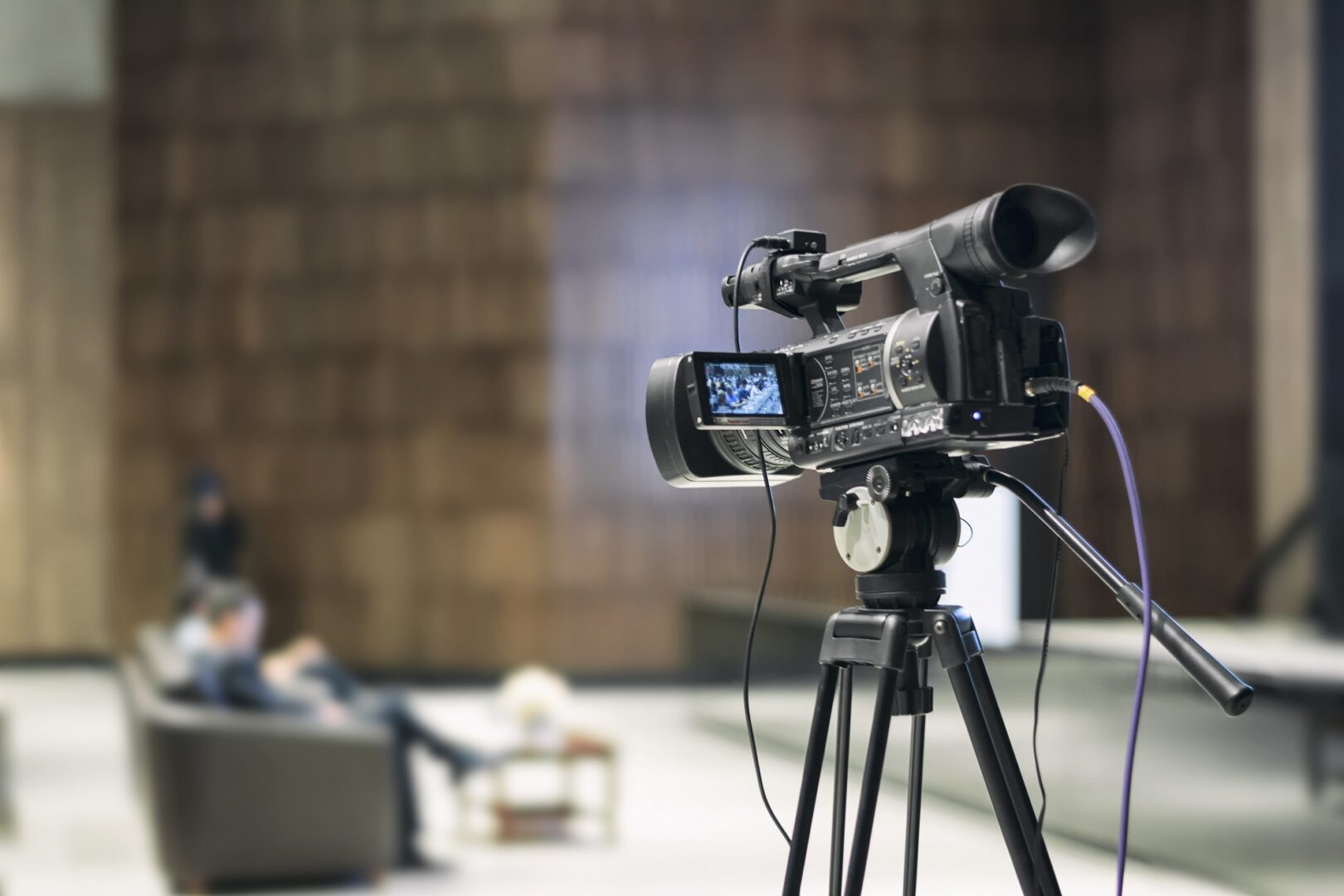 High definition movie camera in a movie set with a news event.