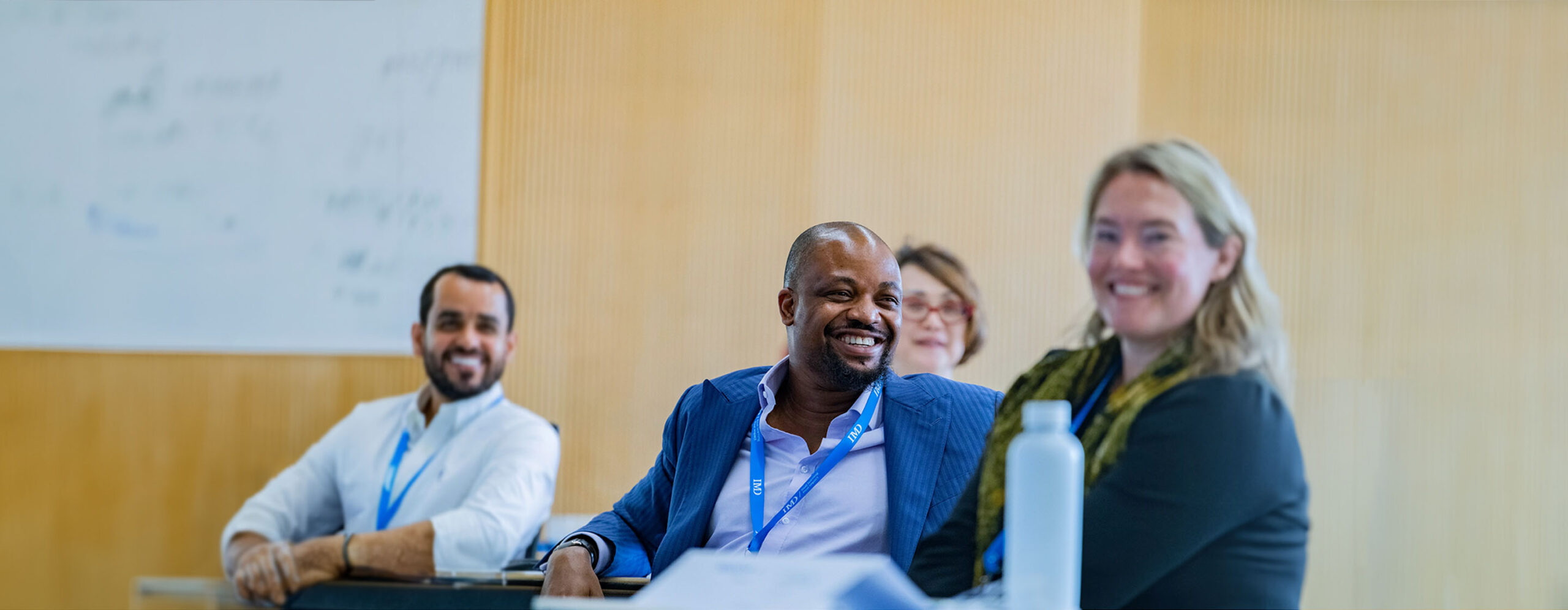 20231207-GlobalPages-Programs&Solutions-TopBanner-BlueFilter-Desktop-2880×1120 - IMD Business School