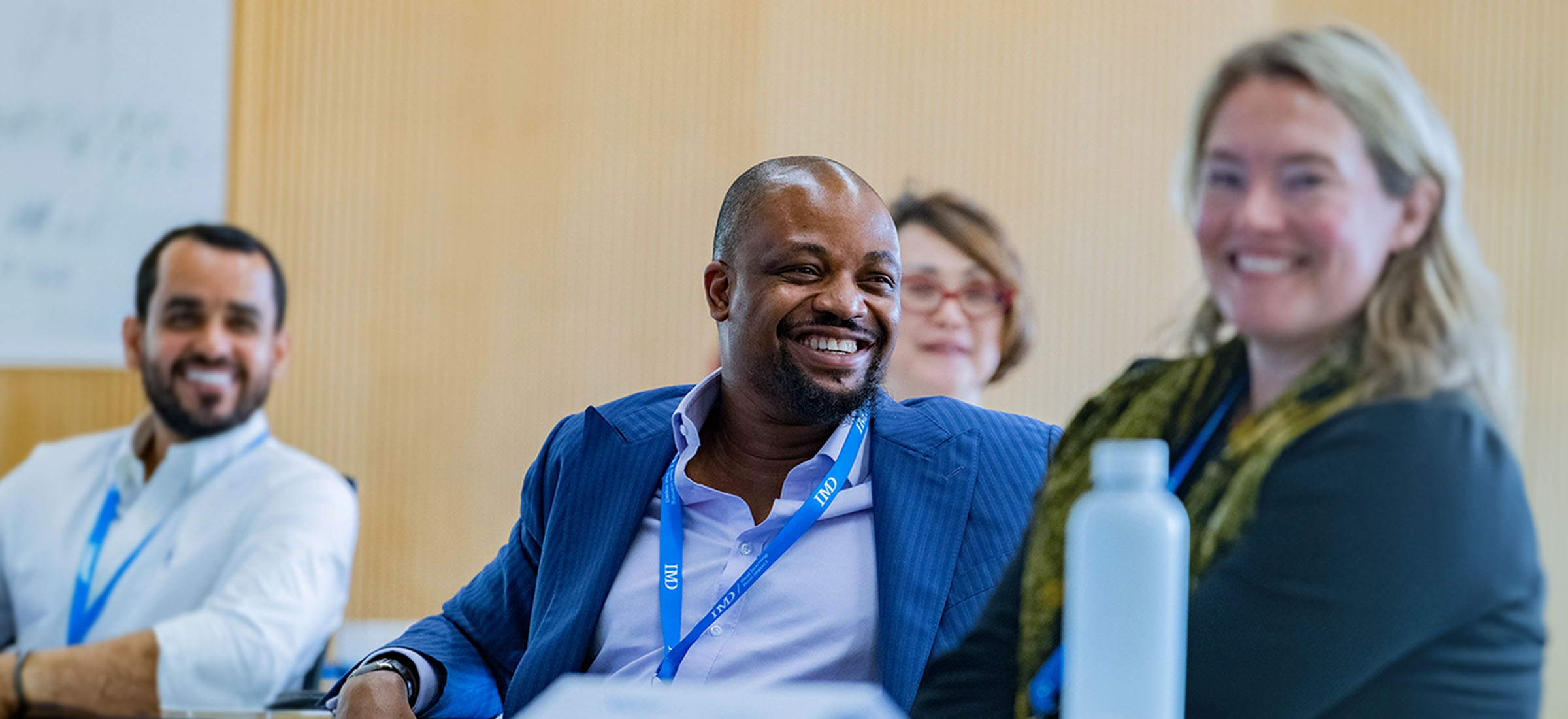 20231207-GlobalPages-Programs&Solutions-TopBanner-BlueFilter-Tablet-2400×1100 - IMD Business School