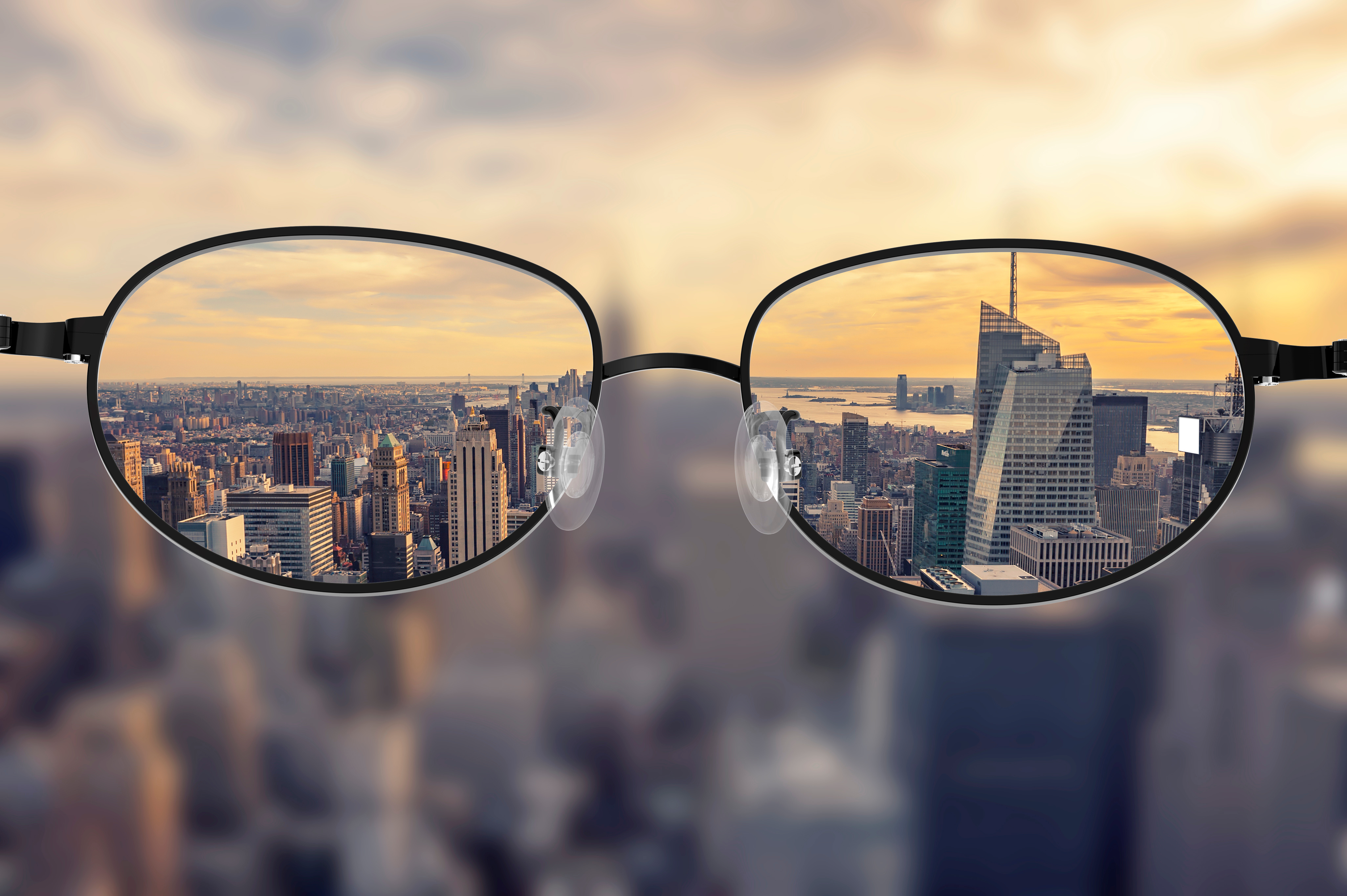 Clear cityscape focused in glasses lenses Transparency