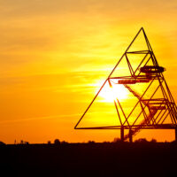 The Tetrahedron in Bottrop is a walkable steel structure in the form of a tetrahedron with a side length of 60m, resting on four 9m tall concrete pillars. It is located in Bottrop, Germany, on top of the mine dump Halde Beckstraße and serves as the town's landmark