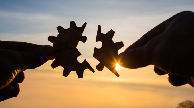 Silhouette Woman hands connecting couple puzzle piece against sunrise, Business solutions, target, success, goals and strategy concepts