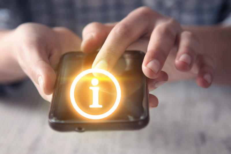 Girl using smartphone with Information Symbol.