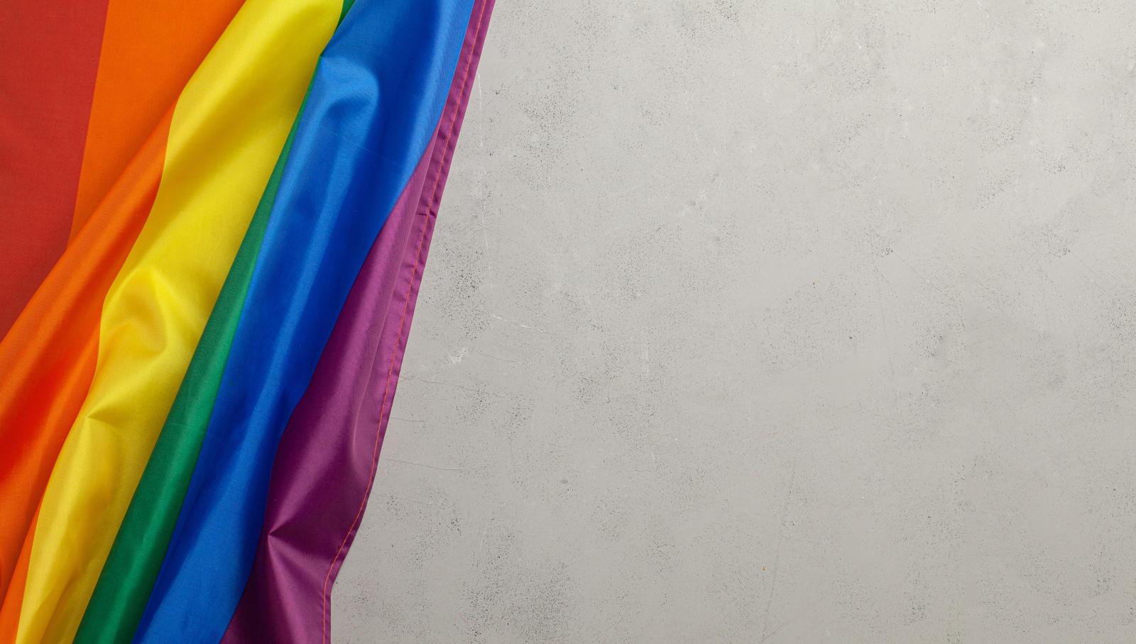 LGBT Pride Rainbow Flag. Grey background.
