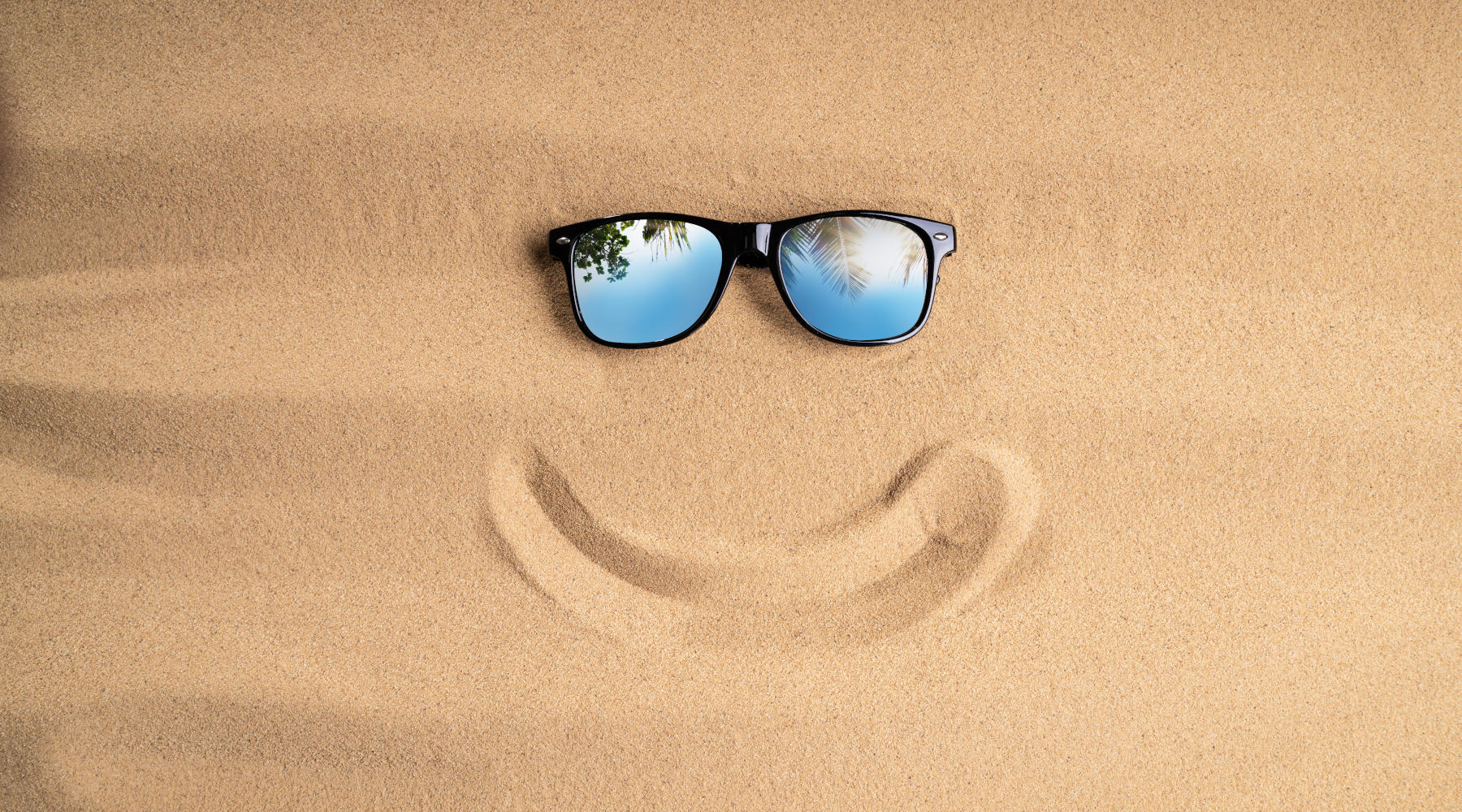 Sunglasses And Smiling Line On Sand At Beach Sunglasses And Smiling Line On Sand At Beach