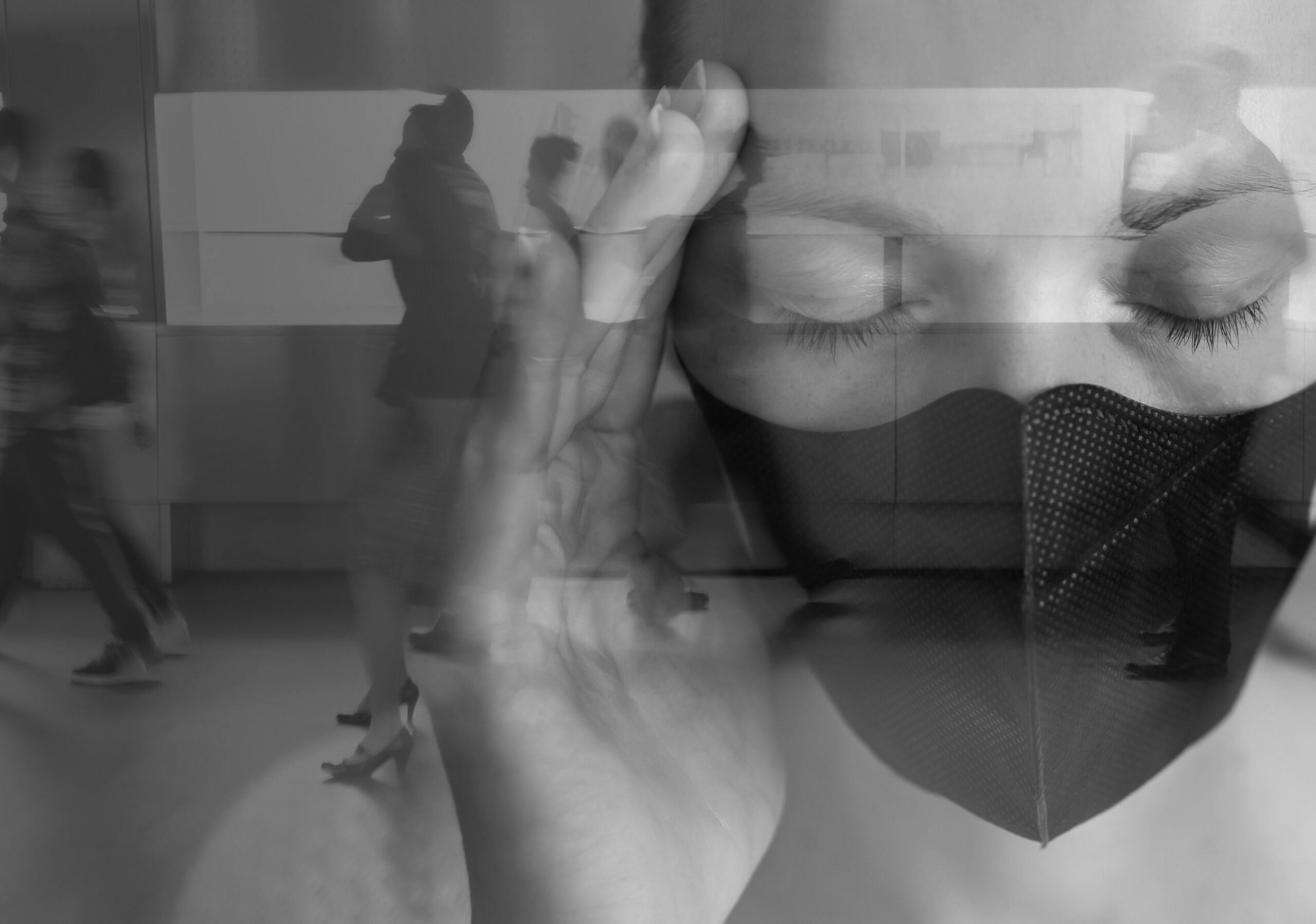 Young woman with face mask blocking out the stress anxiety from busy city environment