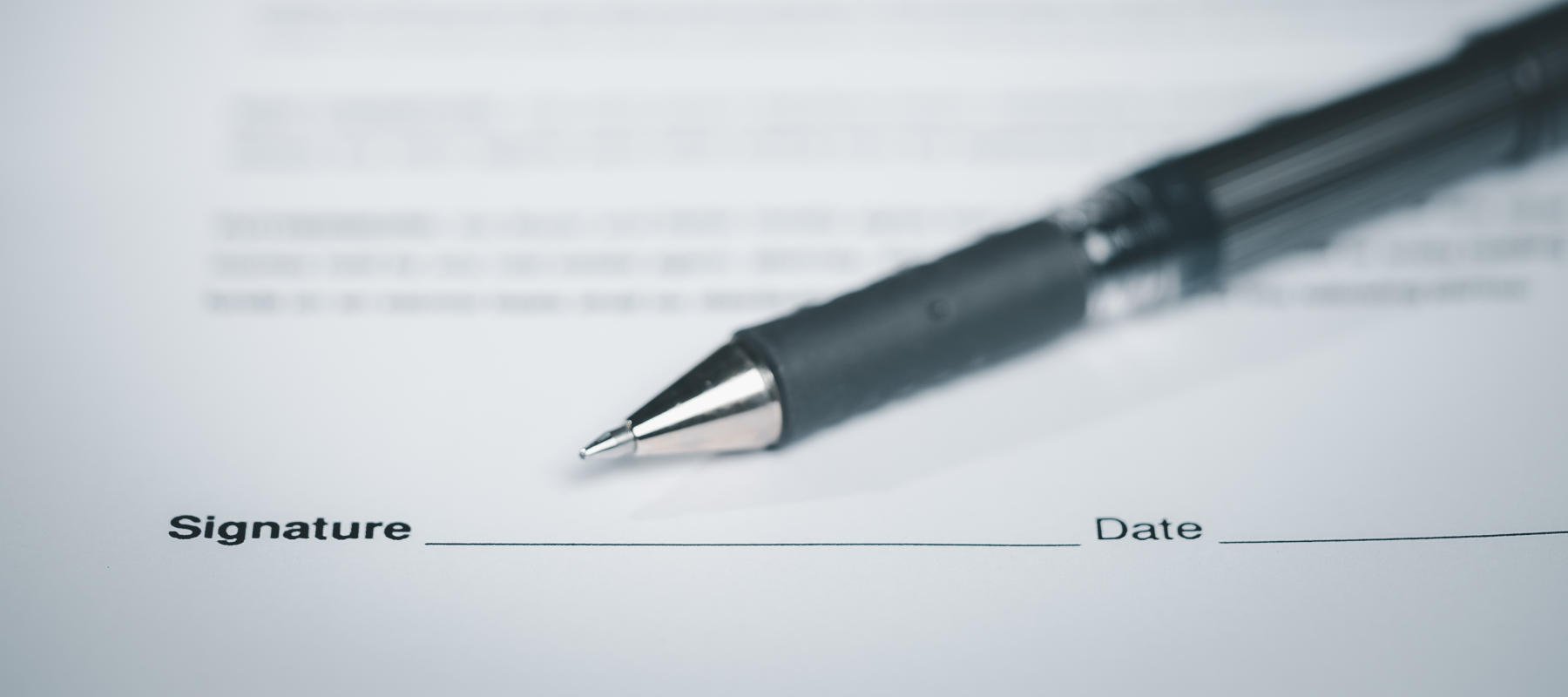 Close Up of Pen on docunent contract agreement sign on document paper