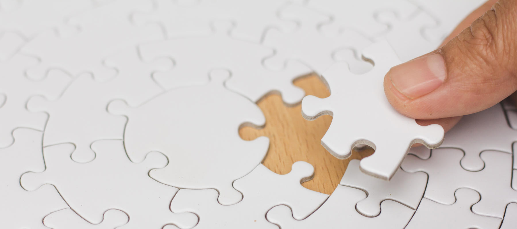 Jigsaw with one piece missing revealingComparative concept