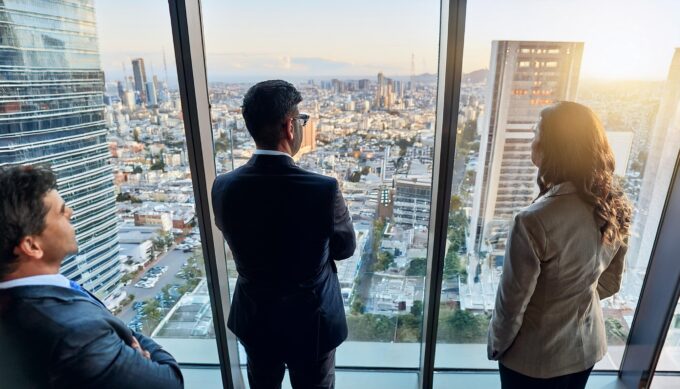 International business people looking outside the window view from top