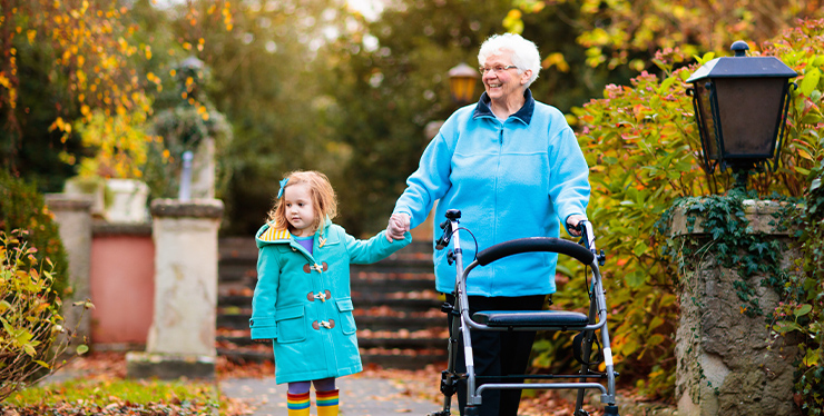 Senior lady with walker enjoying family visit - IMD Business School