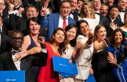 EMBA graduating class of 2024 pose for a photograph. - IMD Business School