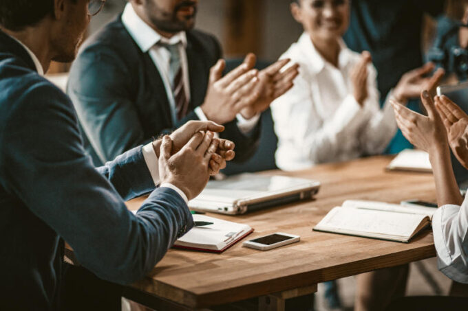 Business People Applauds After Successful Brainstorming