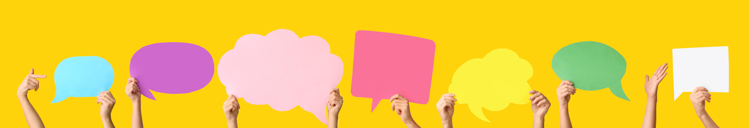 Many female hands with blank speech bubbles on color background