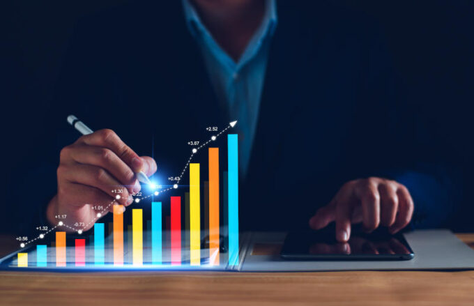 Interest rate and dividend concept Businessman with percentage symbol and up arrow Interest rates continue to increase return on stocks and mutual funds long term investment for retirement
