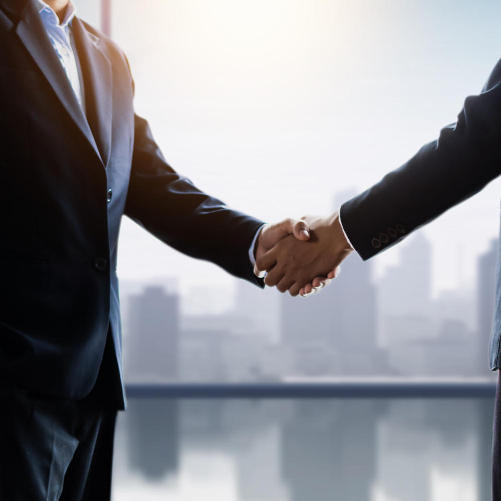 successful negotiate and handshake concept, two businessman shake hand with partner to celebration partnership and teamwork, business deal