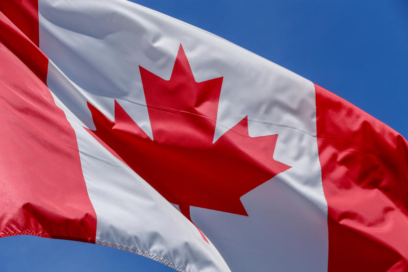 Canadian flag waving on the wind