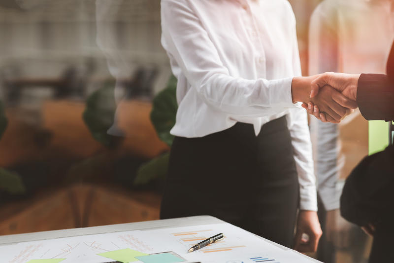 Client shaking hands or Business handshake with insurance agent