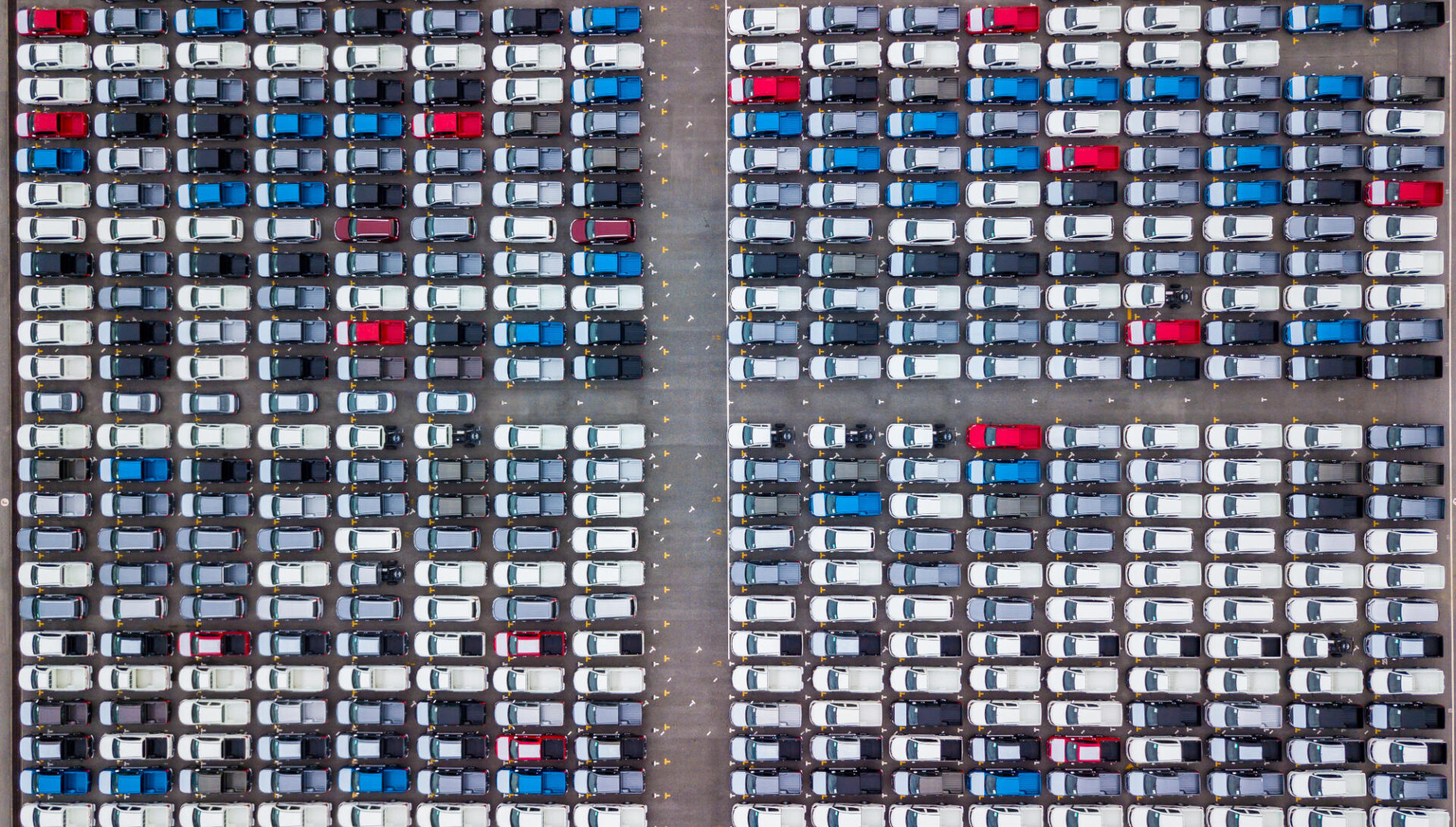 Aerial view new cars parking for sale stock lot row New cars de