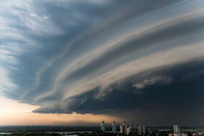 storm cloud is approaching the city Bad weather A dark cloud eclipses the sky severe storm