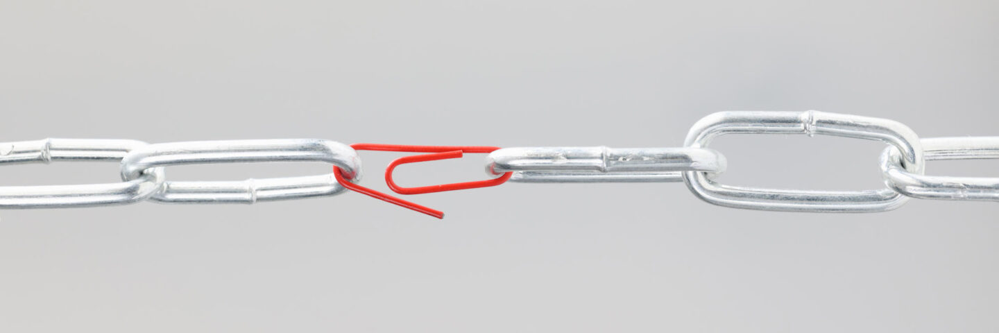 Chrome chain in middle with red paper clip