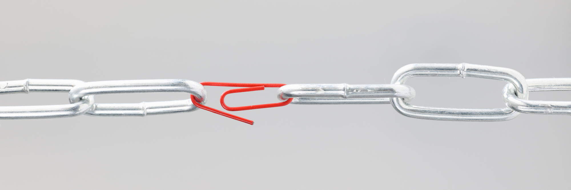 Chrome chain in middle with red paper clip