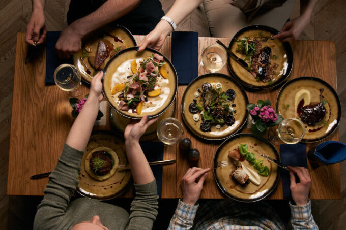 Company gathering for Christmas or New Year party dinner at fest