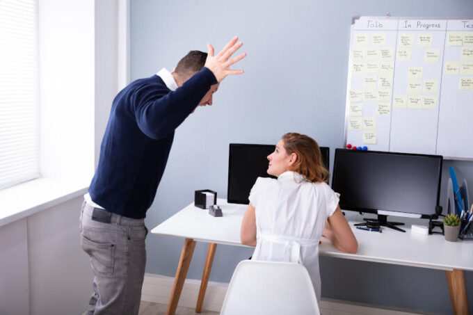 Angry Businessman Shouting At Female Executive