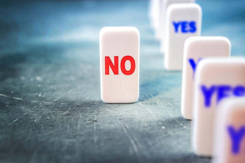 Be able to say no idea Disagreement and protest concept with one block named No among the blocks named Yes