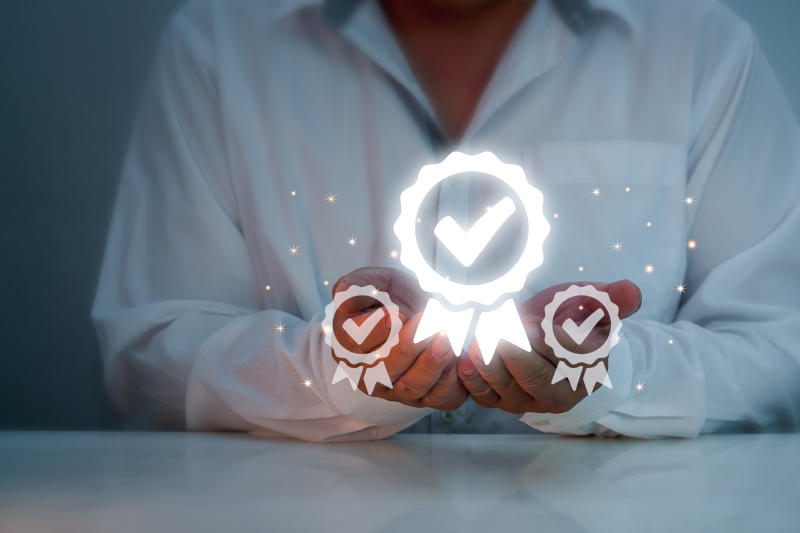 Business people hold and display the best quality assurance warranties product and service standards ISO certificates standardized service Icon for product warranty and ISO service concept