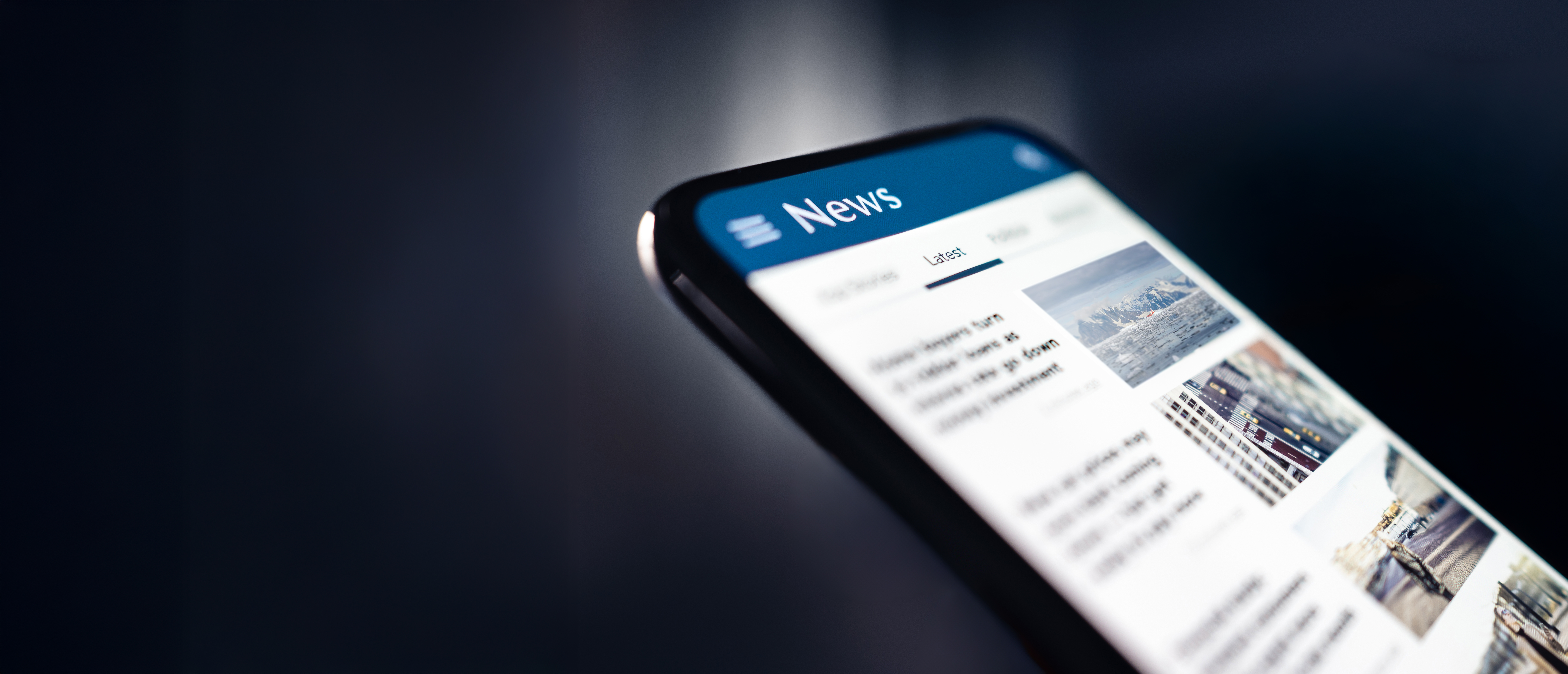 News and press release Headlines and newspaper media in phone Reading articles online Mobile in hand Feed breaking report or business publication - IMD Business School