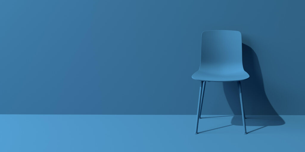 Blue chair in blue minimal room - IMD Business School