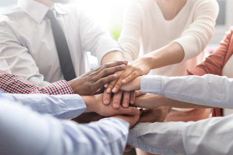 Stack of hands Unity and teamwork concept