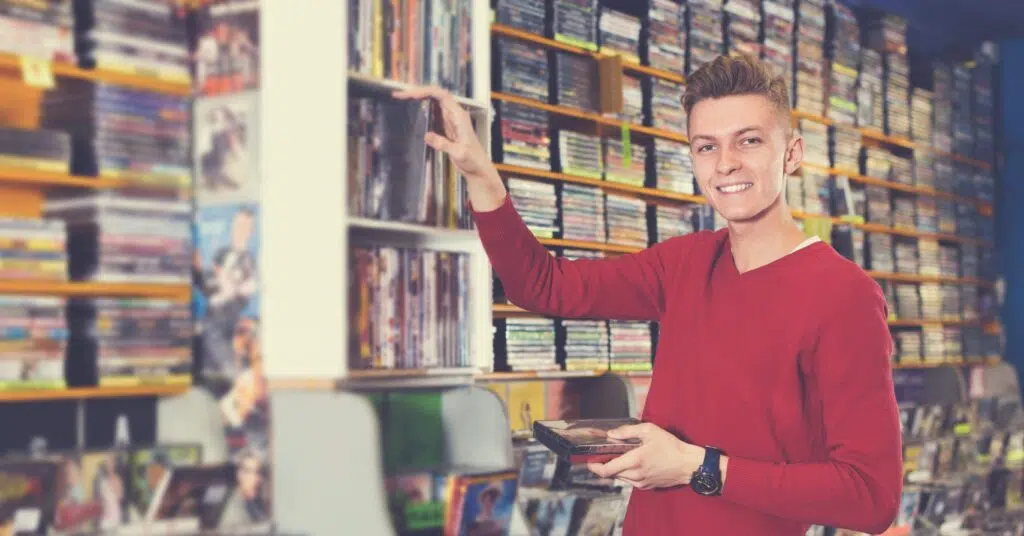 Man browsing in a blockbuster shop - IMD Business School